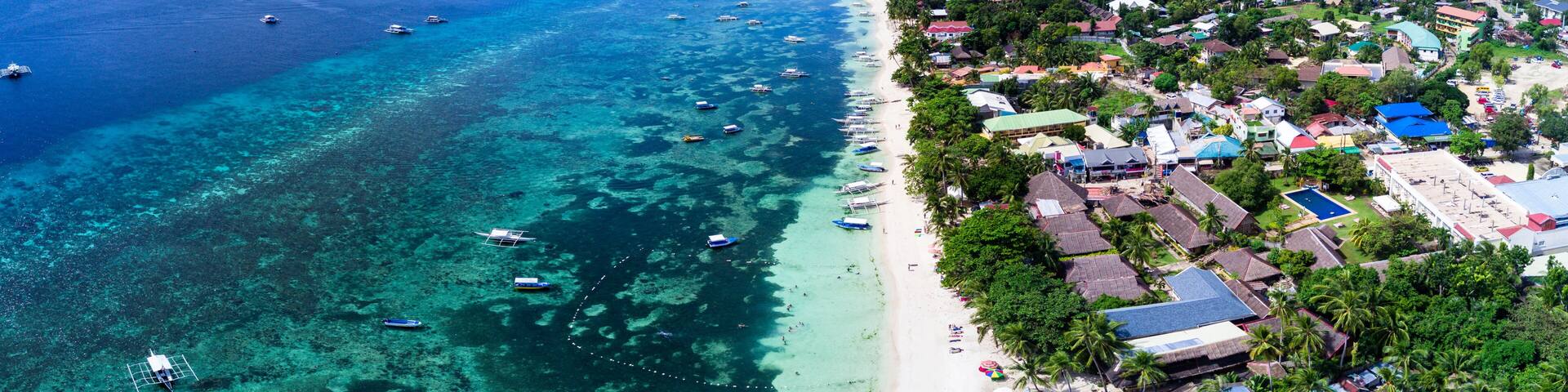 Panorama Aerial drone picture of the white sand Alona Beach in Panglao, Bohol, Philippines
