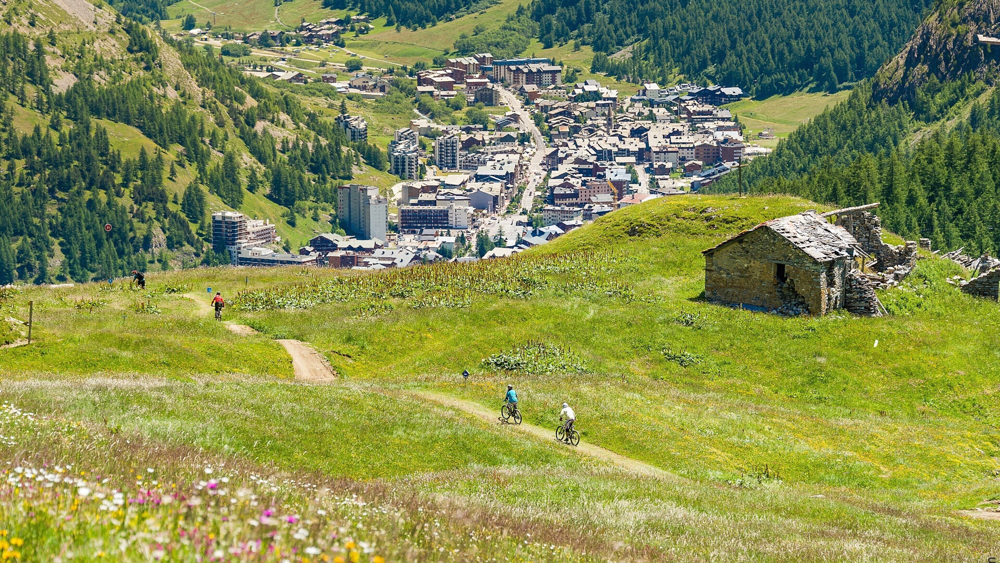 A mountainous landscape with a small village nestled in the valley.
