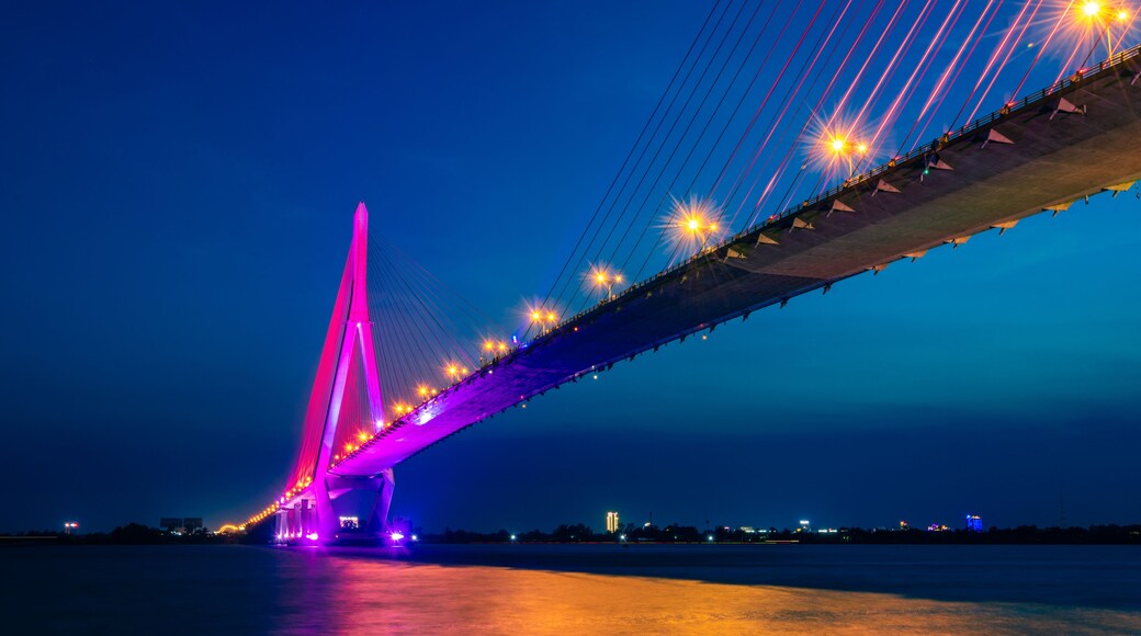 Shimmering night lights by Can Tho bridge, Vietnam