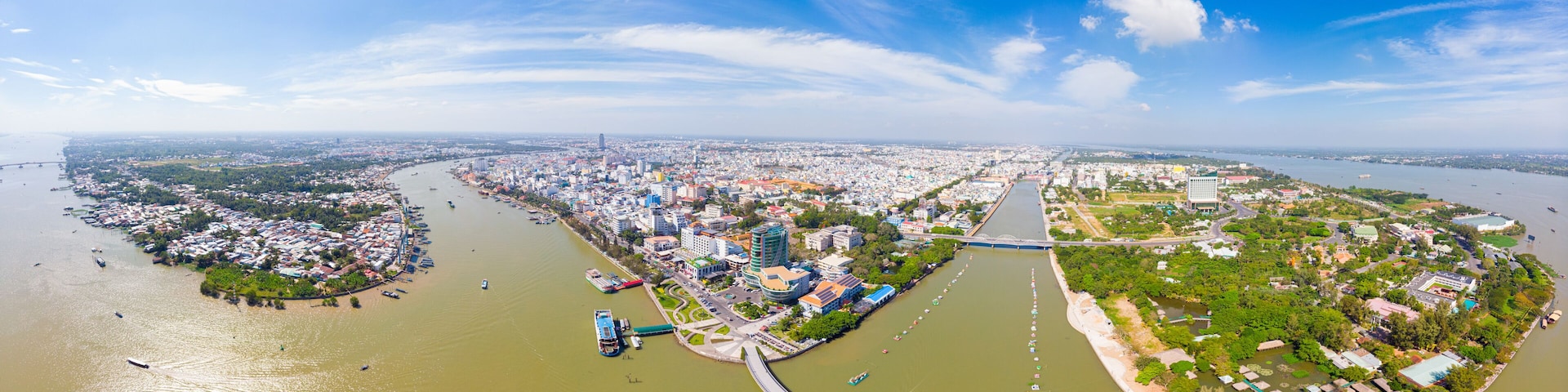Aerial view Can Tho city skyline from above, Mekong river delta, South Vietnam. Famous tourism destination floating markets. Clear blue sky.