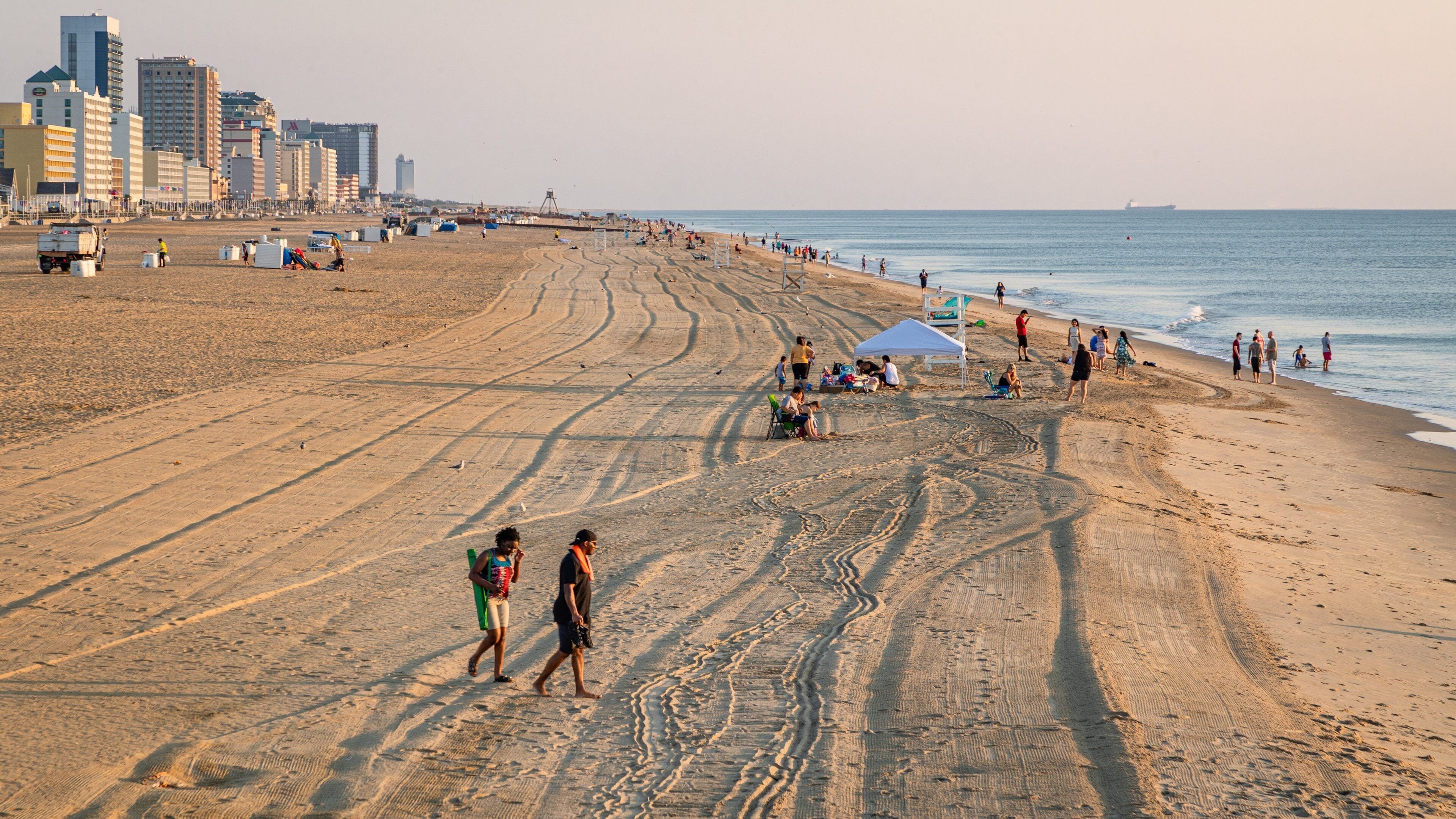 Virginia Beach featuring a sandy beach, a coastal town and a sunset