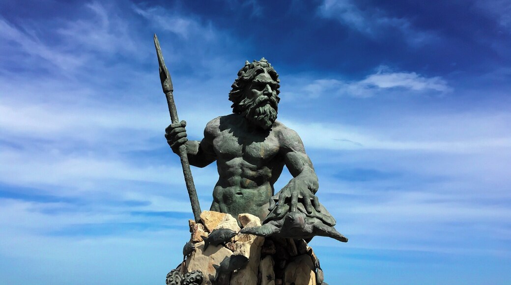 Everything the light touches is his Kingdom!
There he stands, guarding his seas and people, standing tall, gazing at the horizon; he is one with the ocean. King Neptune!
It is the Neptune Statue at the boardwalk of the Virginia Beach.