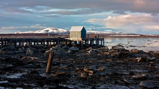 Dock Shack on an Alaskan Beach with Snow and Ice