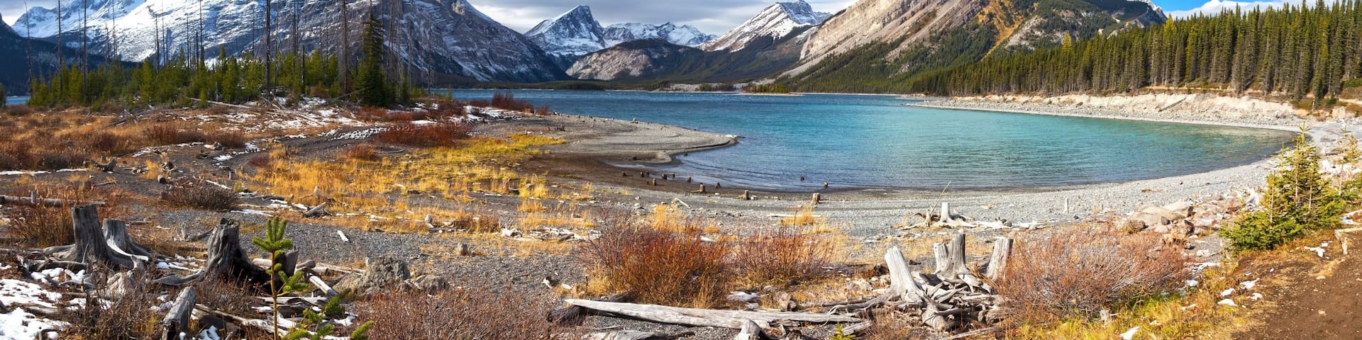 Autumn Colors, Distant Snowcapped Mountain Peaks and Wide Panoramic Landscape of upper Kanananskis Lake in Canadian Rockies, Alberta Canada