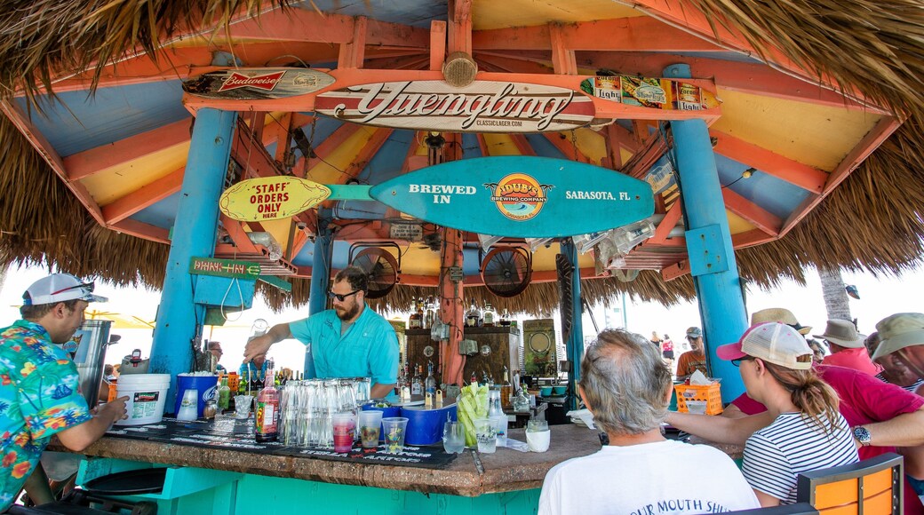 Venice showing a beach bar as well as a small group of people
