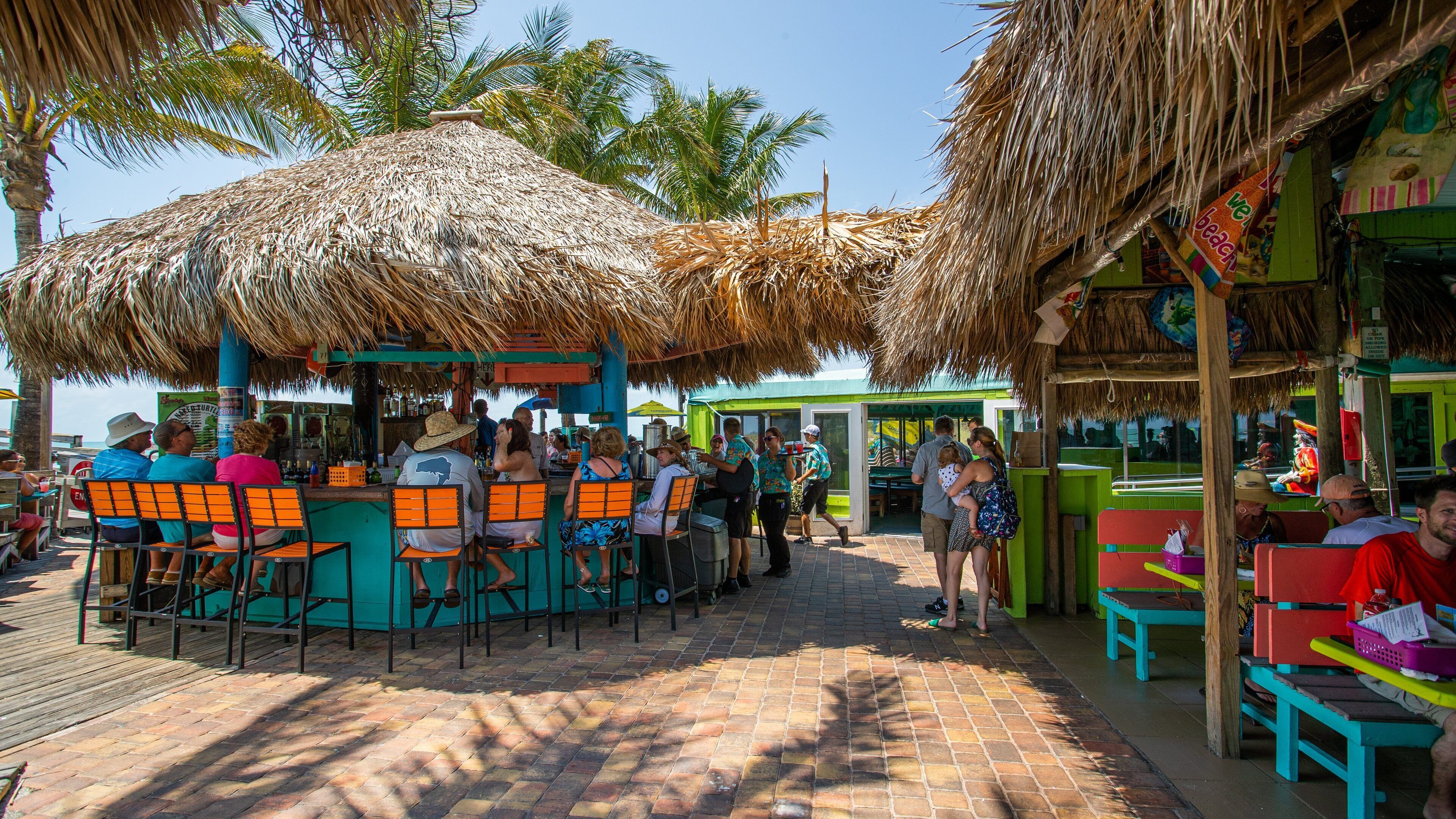 Venice which includes a beach bar as well as a small group of people