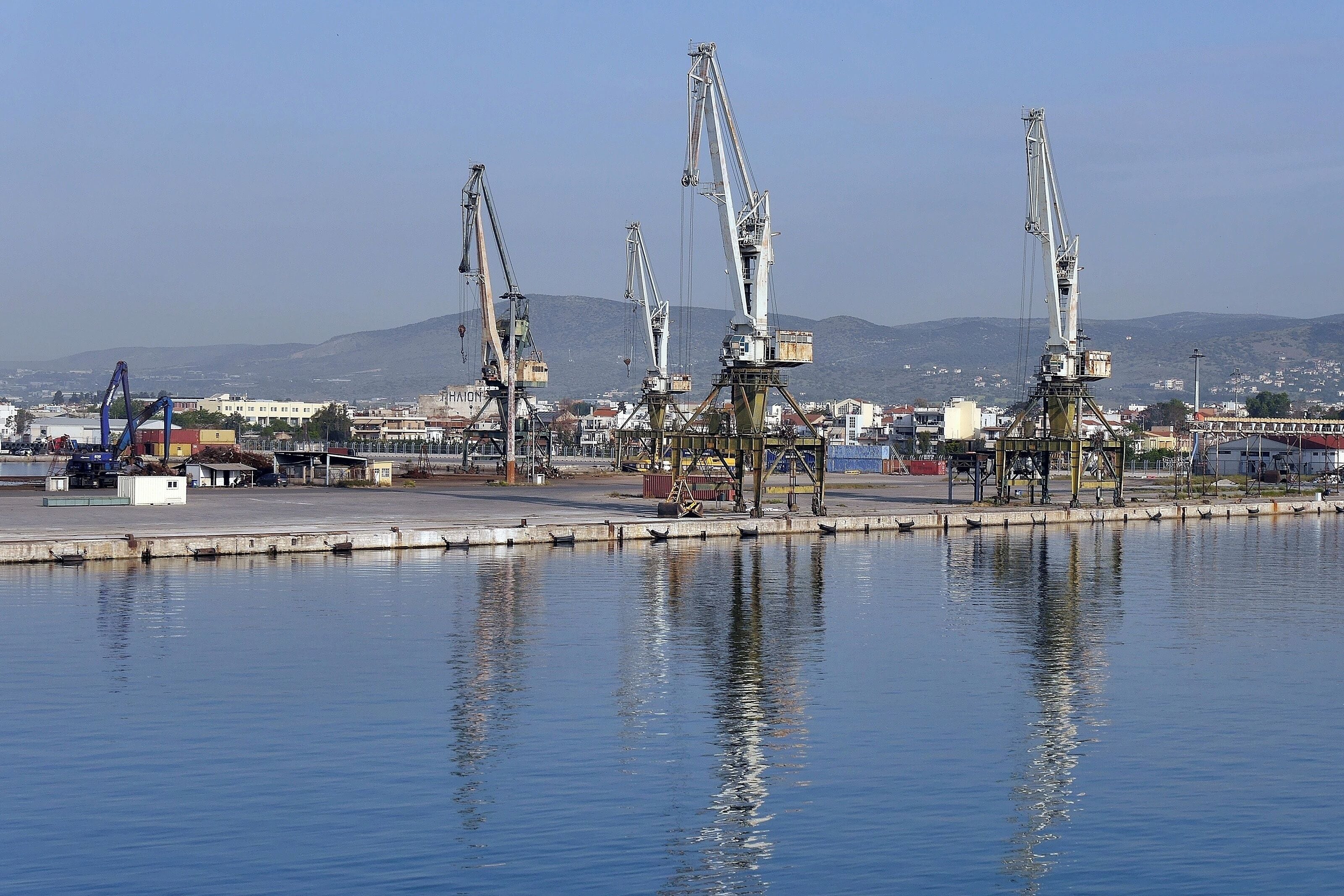 Idle cranes at the working port of Volos. Volos is wonderfully situated as the gateway to the Pelion region of Greece with its stunning countryside and beautiful hillside villages.
It is a bustling, busy city with a large fishing harbour as well as the working port.
And it serves as the base for ferries travelling to the nearby Sporades islands.