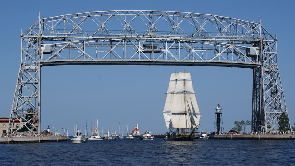 Duluth featuring a bridge, a bay or harbor and modern architecture
