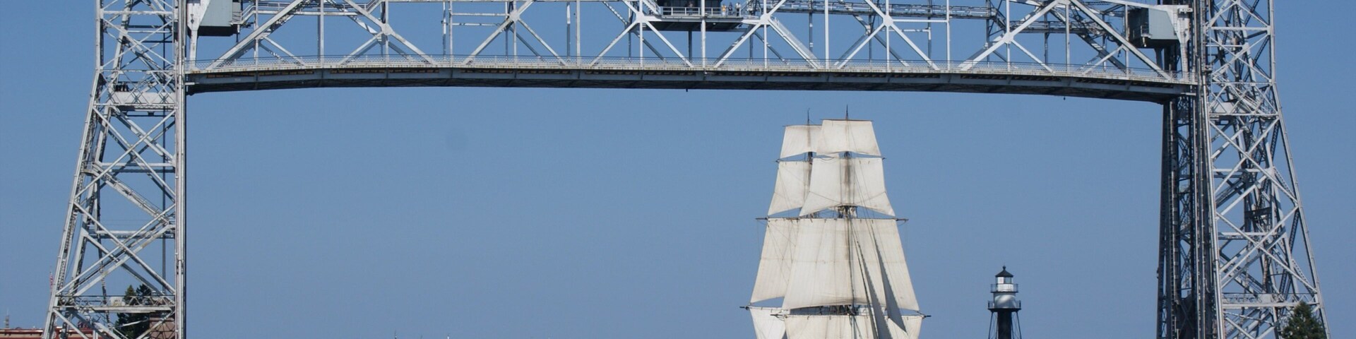 Duluth featuring a bridge, a bay or harbor and modern architecture