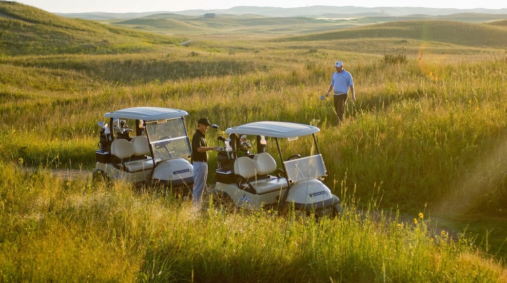 Valentine featuring golf and landscape views as well as a small group of people