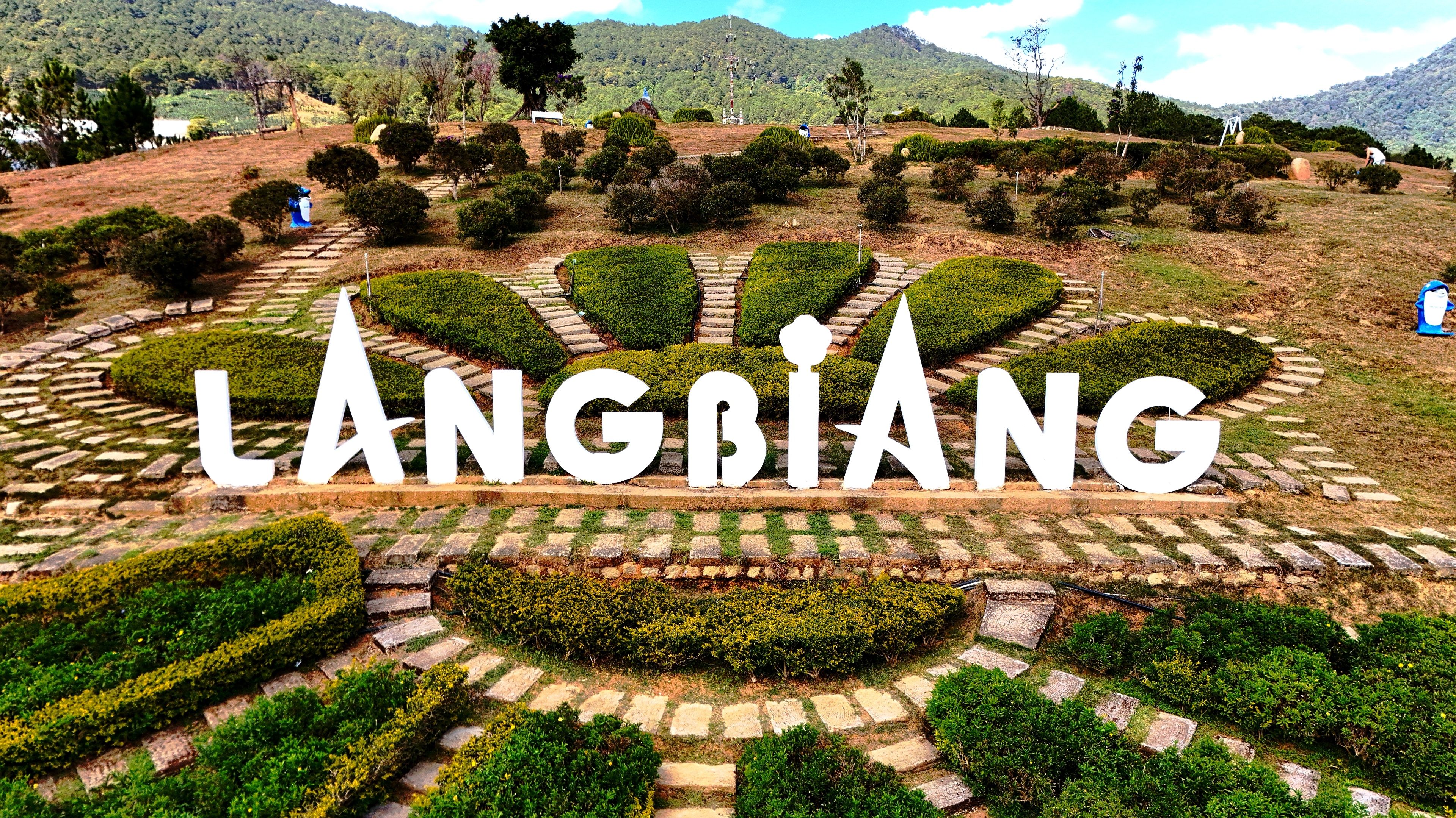 Scenic views of Lang Biang Mountain near Da Lat, Vietnam, featuring rolling hills, green valleys and natural highland landscapes in the Central Highlands.