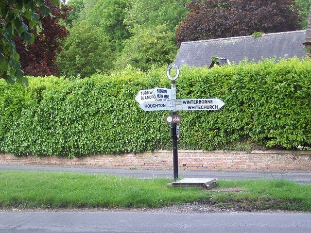 Fingerpost, Winterborne Stickland Winterborne Stickland is first and foremost a working village. Its many thatched houses are interspersed with more modern buildings which have mellowed with the years into a harmonious whole.