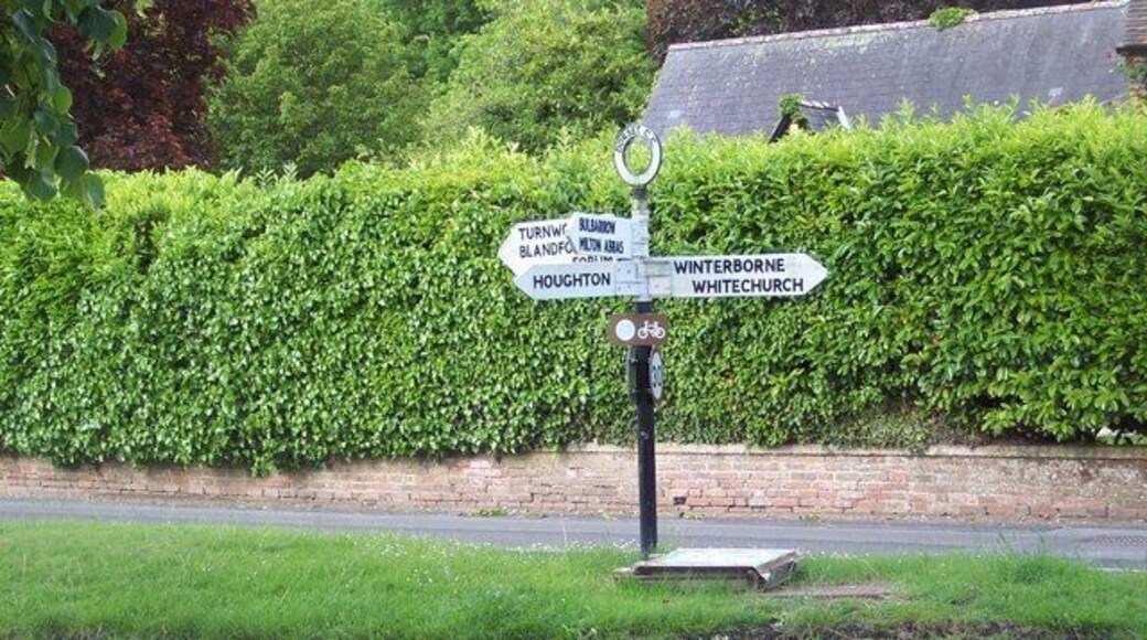 Fingerpost, Winterborne Stickland Winterborne Stickland is first and foremost a working village. Its many thatched houses are interspersed with more modern buildings which have mellowed with the years into a harmonious whole.