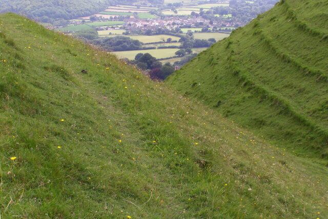 Iron-age earthworks, Hambledon Hill Looking along a ditch on the south-eastern side of the hill fort on Hambledon Hill. The village in the distance, down in the Stour valley, is Shillingstone.