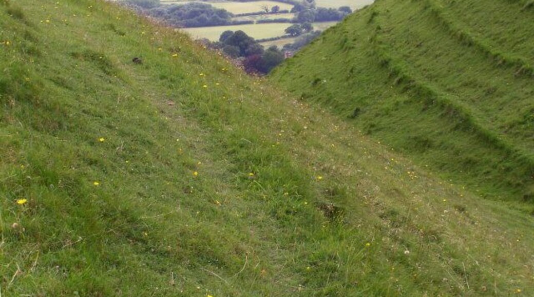 Iron-age earthworks, Hambledon Hill Looking along a ditch on the south-eastern side of the hill fort on Hambledon Hill. The village in the distance, down in the Stour valley, is Shillingstone.