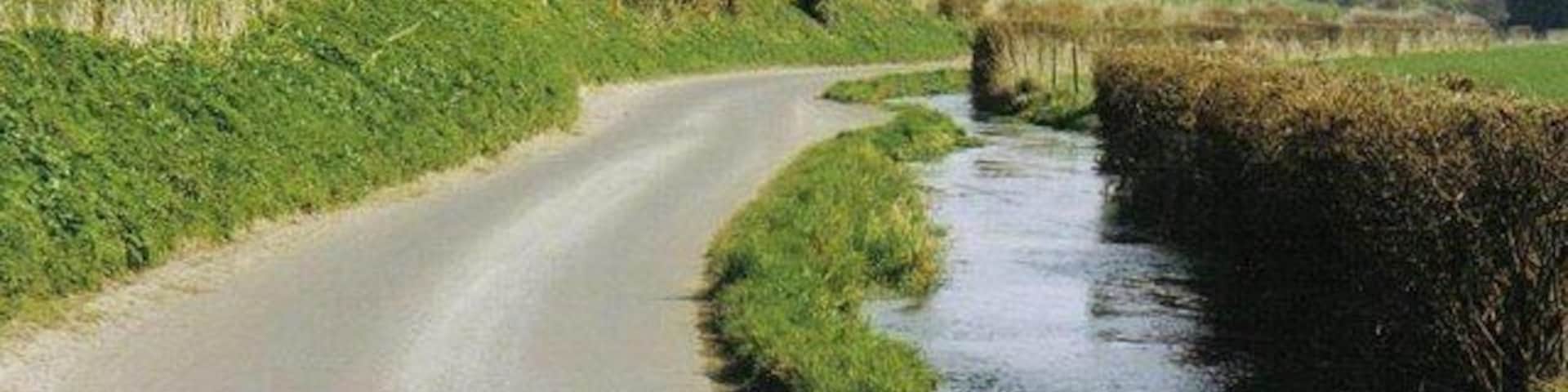 Winterborne Houghton: lane and stream The river Winterborne meanders down past Winterborne Houghton, the first of eight villages it will meet with 'Winterborne' in its name before it joins the Stour at Sturminster Marshall.