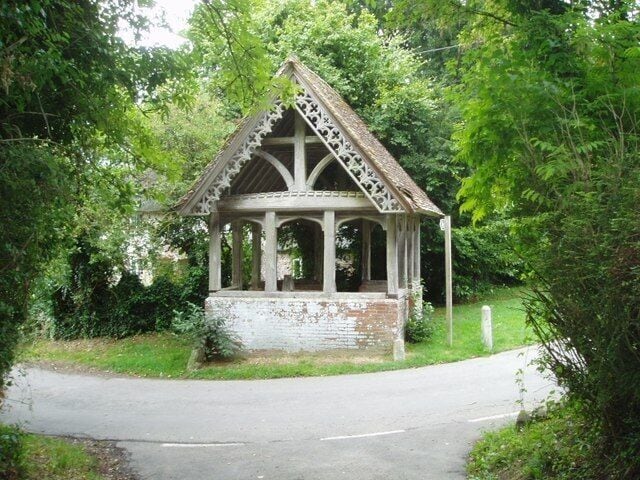 Well near St Laurence church at Farnham. The village well now disused