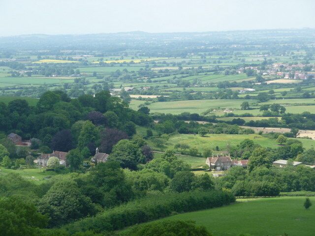 Stoke Wake: looking down on the village Looking down from the slopes of Bulbarrow Hill on the church (see 522973) and Manor Farm of the little village of Stoke Wake. Glorious views of the Dorset countryside are beyond.