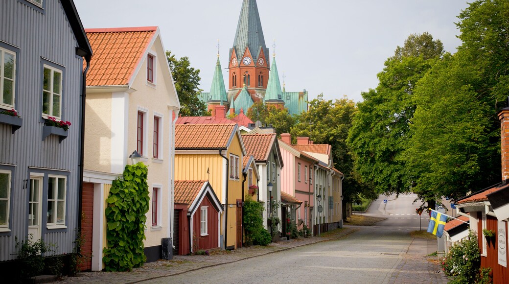 Street of houses in a town of northern Europe + church top. Sweden