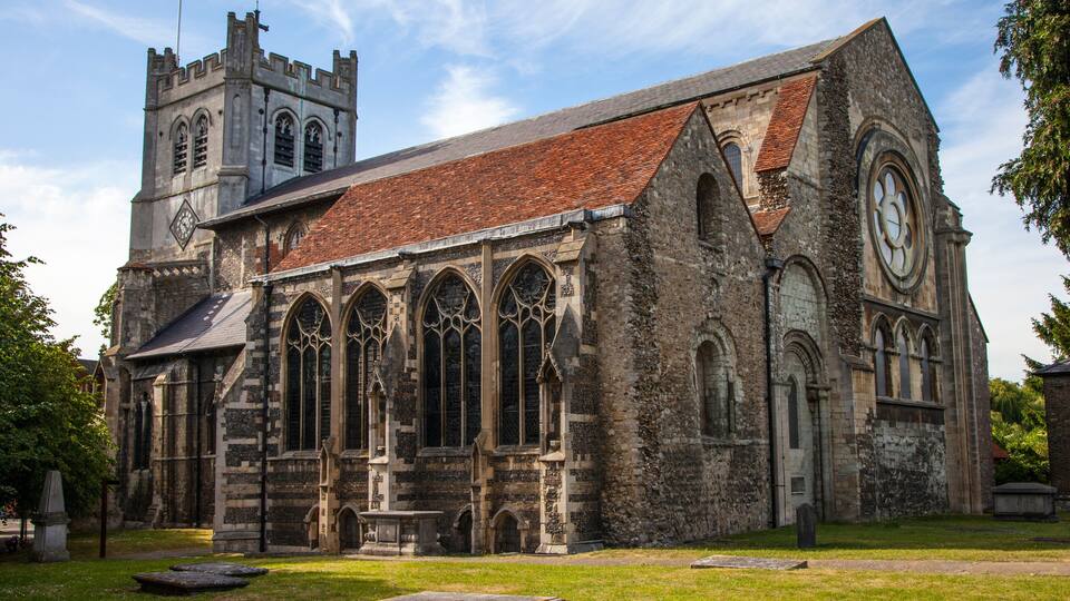 A historic church with a clock tower and arched windows.