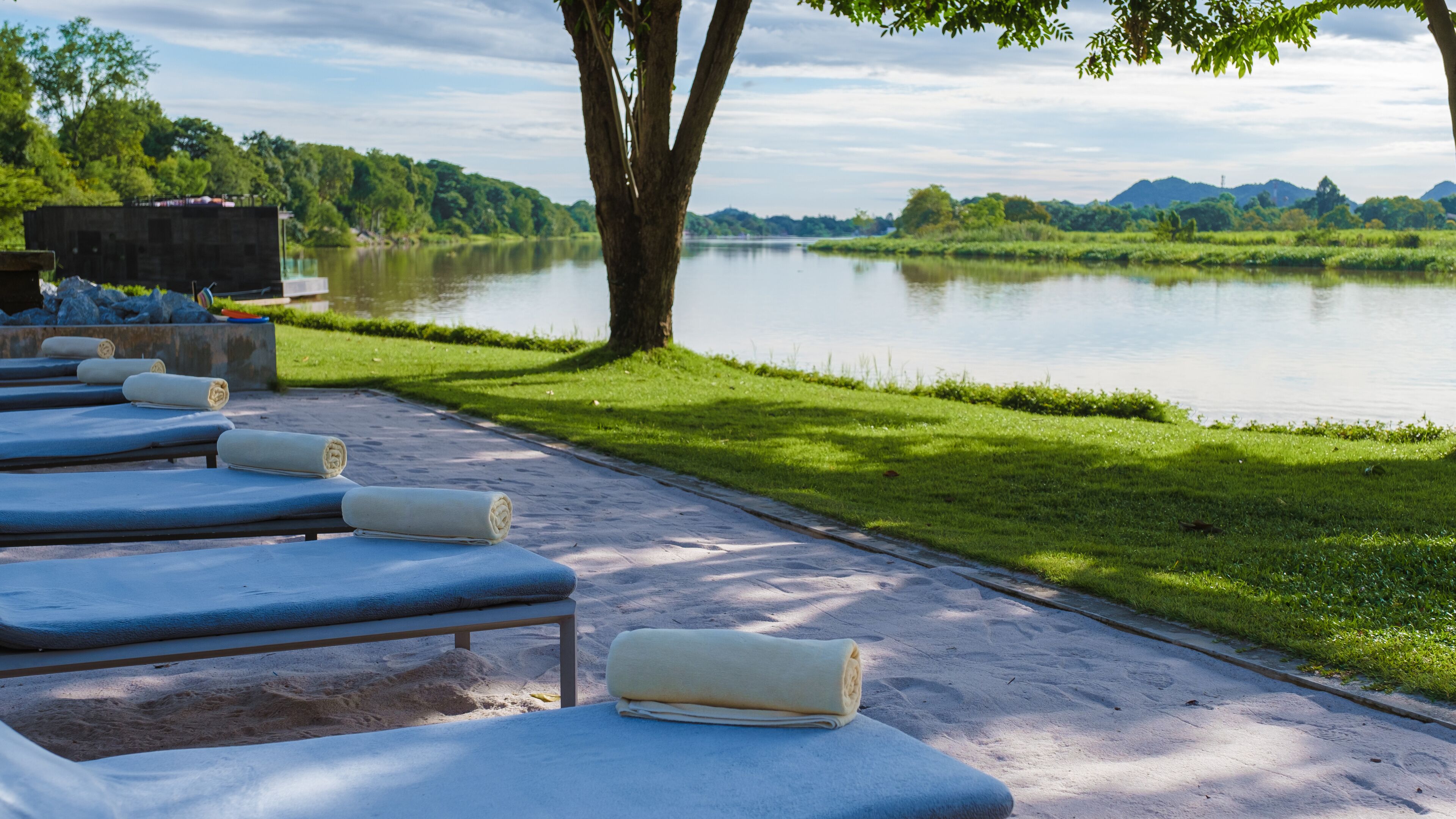 Luxury swimming pool by the River Kwai in Thailand. The pool at the river side of the River Kwai Kanchanaburi