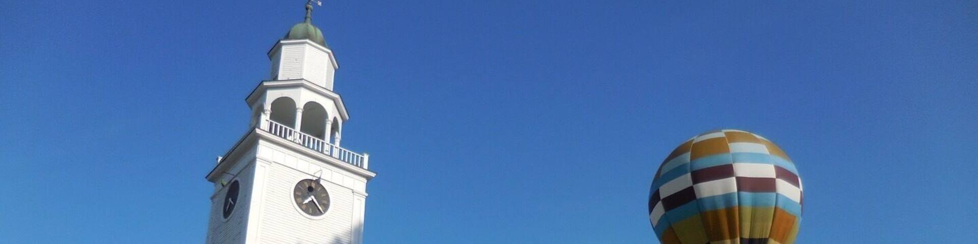 Watching this scene my mind went on flights of fancy. Imagine, you are looking at a typical New England Church from the 18th century, while in the backdrop watching a more modern version of an 18th century flight technology!