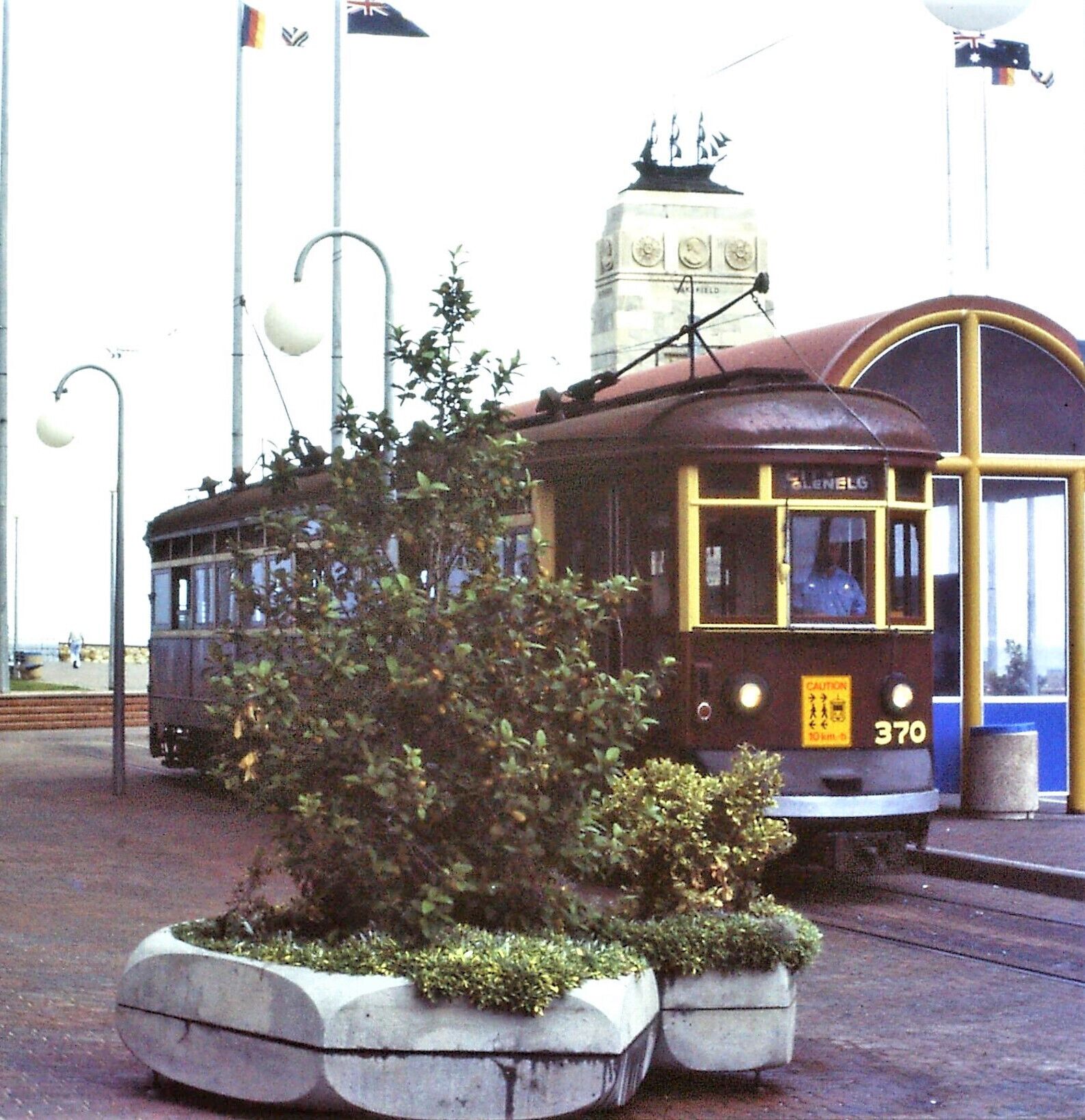 Glenelg tram stop at the end of the line from Adelaide (1986 photo) + Pioneer Memorial