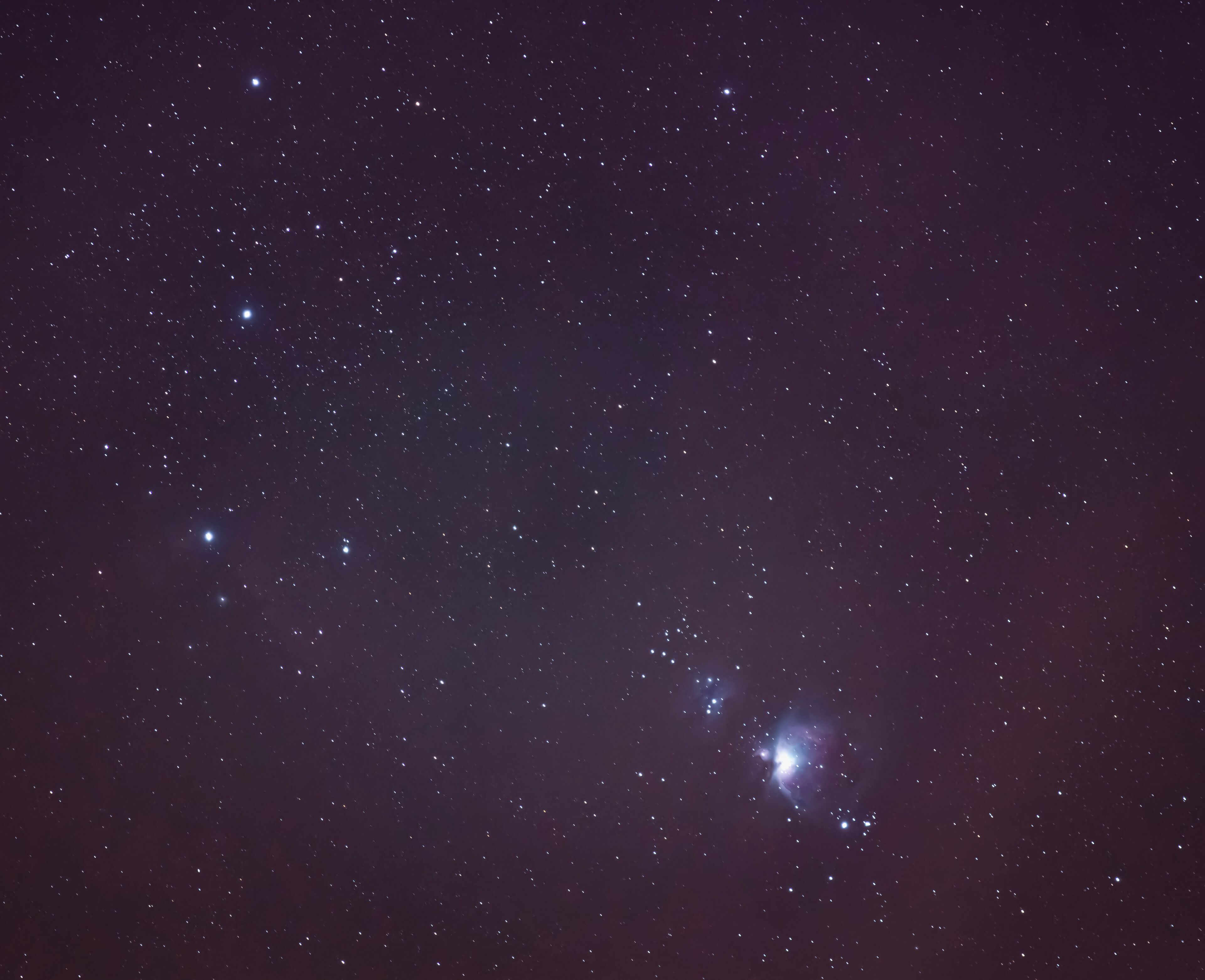 Last night I was able to set up my star tracker and mount up my camera to capture the Orion Nebula. This is the first time I have even attempted something like this. Before I have only used my tracker for wide landscape shots. 

The three stars on the left are Orion's belt. The Nebula is in the middle of Orion's scabbard. The nebula is estimated to be 24 light years across. It has a mass of about 2,000 times that of the Sun.

You can actually see Orion's nebula with the naked eye, that is why the scabbard looks fuzzy. You can also see this with just a pair of binoculars, this image was taken at 200 mm, so not too much zoom. 