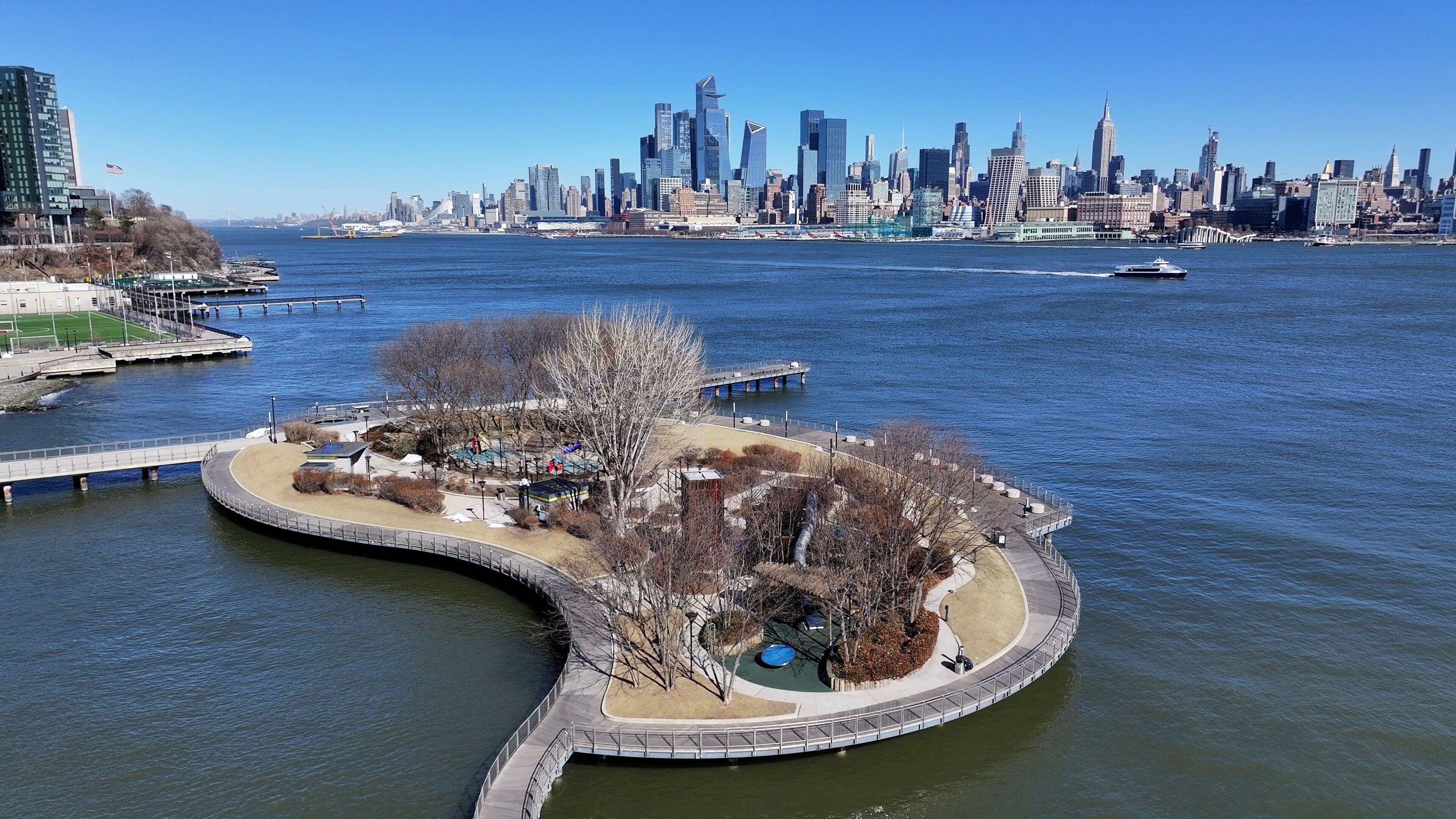 Hudson River Walkway At Jersey City In New Jersey United States. Downtown District. New York Skyline Scene. Hudson River Walkway At New Jersey United States. Walkway Landscape. 
