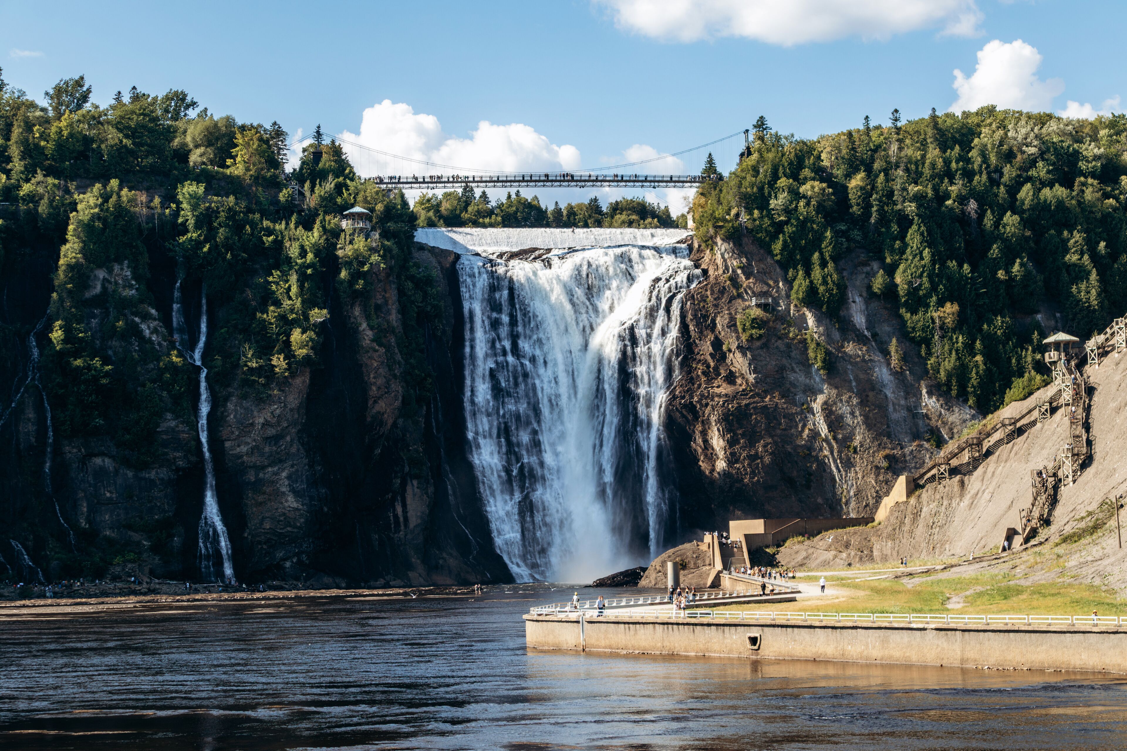 Montmorency Falls waterfall with suspension bridge, observation platforms and staircase at Parc de la Chute Montmorency near Quebec City