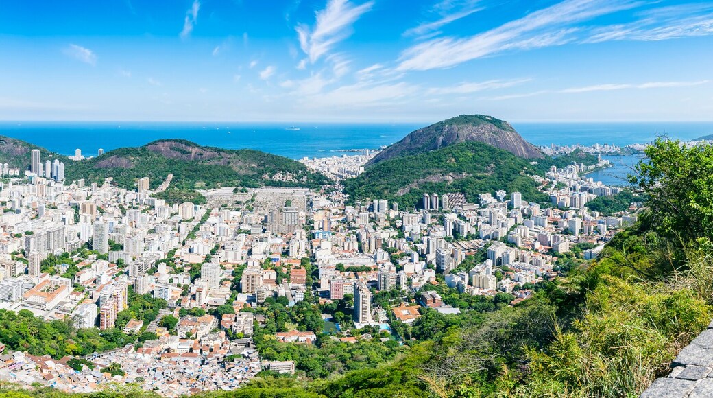 Scenic panorama of the Rio de Janeiro, Brazil city skyline with Sugarloaf Mountain Botafogo and Guanabara Bay under bright blue Brazilian skies