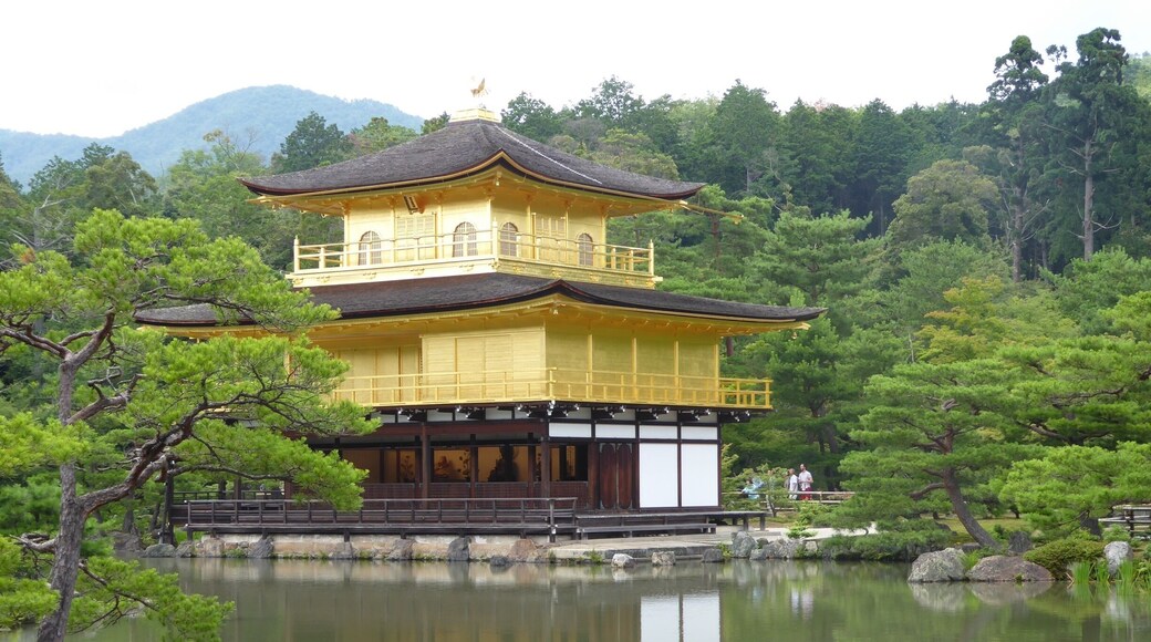 Kinkakuji (金閣寺, Golden Pavilion) is a Zen temple in northern Kyoto whose top two floors are completely covered in gold leaf.