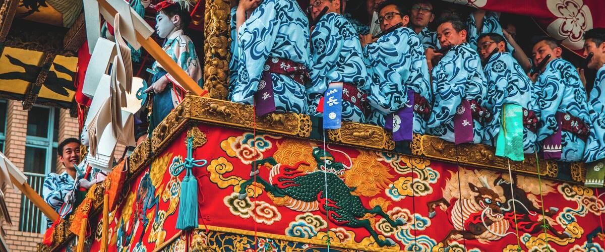 The Gion Matsuri Festival is Japans most famous festival. Musicians sit in huge floats that are pushed/dragged around town in Kyoto while the musicians play their flutes. There are two types of floats in The Gion Matsuri Parade, Yama and Hoko. There are 23 Yama and 10 Hoko. The Hoko floats can be up to 25 meters tall and weigh up to 12 tons.
The main procession of the floats are held on the 17th of July, which is when this photo was taken. #Festival