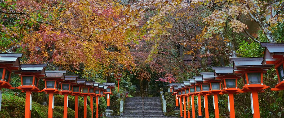 Traditional lamp posts beside the stairs in the Kurama Dera Temple, Kyoto, Japan.