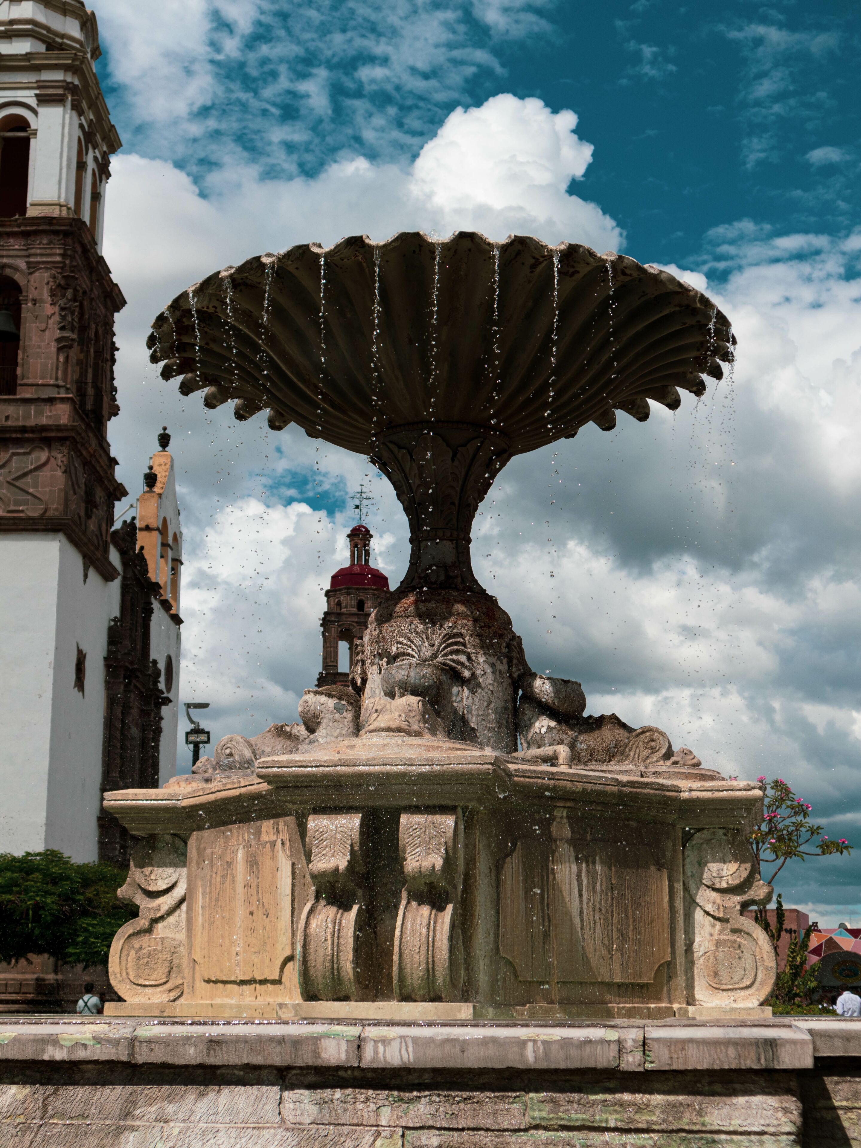 Beautiful fountain in front of Irapuato Cathedral in Mexico on a sunny day