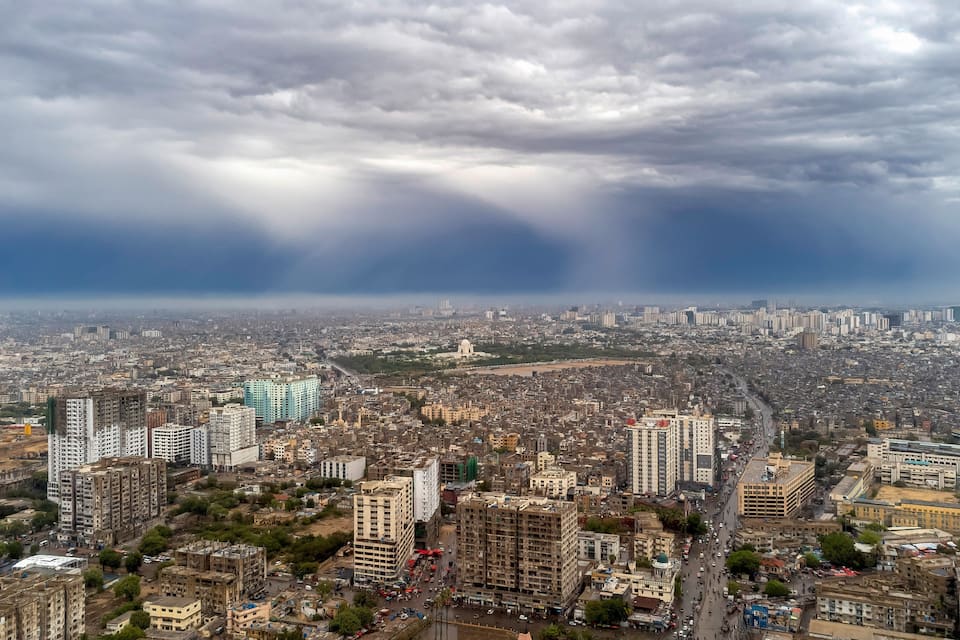 Karachi, Pakistan - May 10, 2026: Dramatic aerial view of Karachi city under heavy monsoon rain clouds. Panoramic urban cityscape of Karachi
