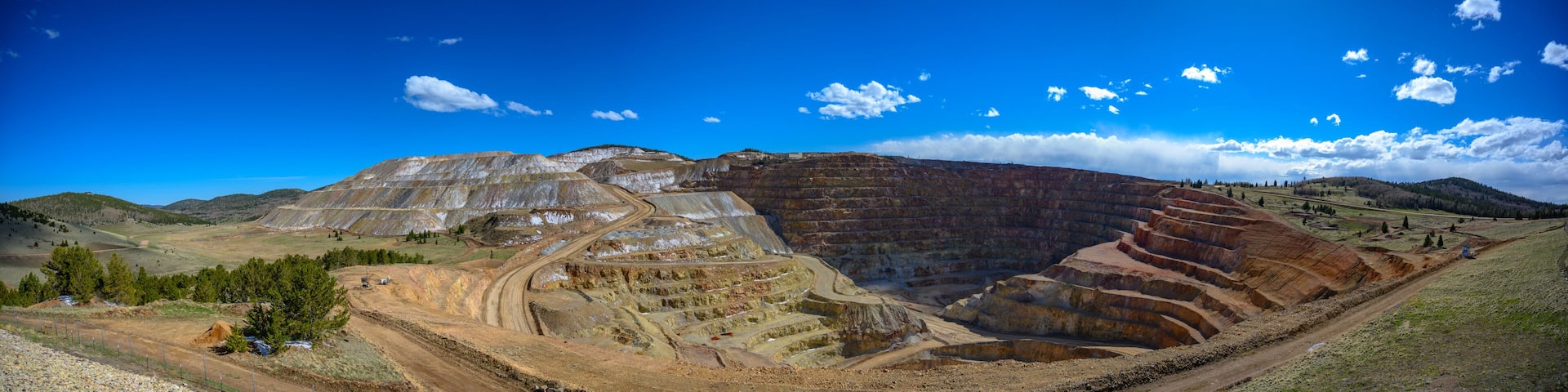 Panoramic view of the Victor Cresson Mine, an active open pit gold mine in Cripple Creek, Colorado, USA
