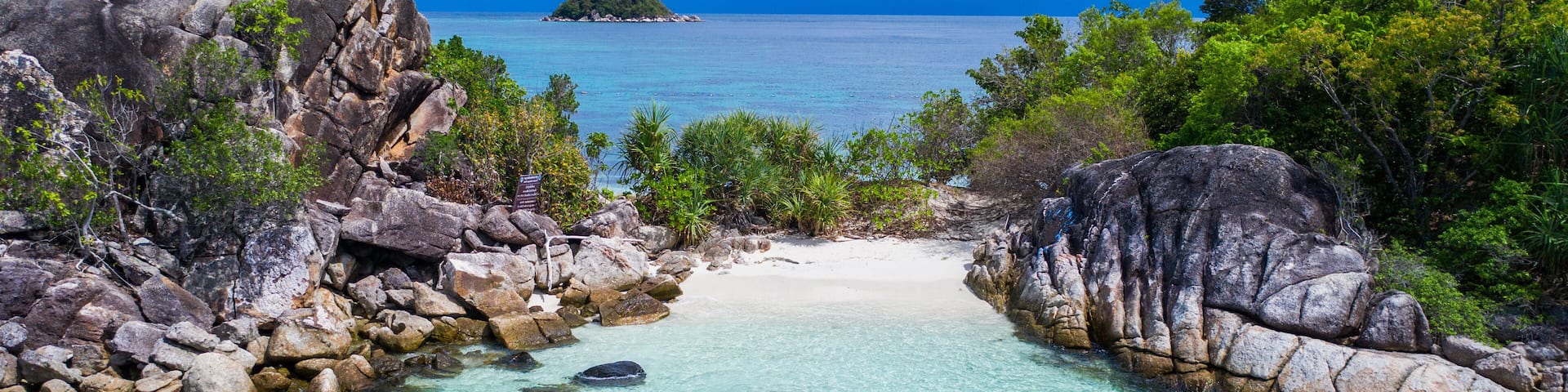Aerial drone view of in kayak in crystal clear lagoon sea water during summer day near Koh Lipe island in Thailand. Travel tropical island holiday concept