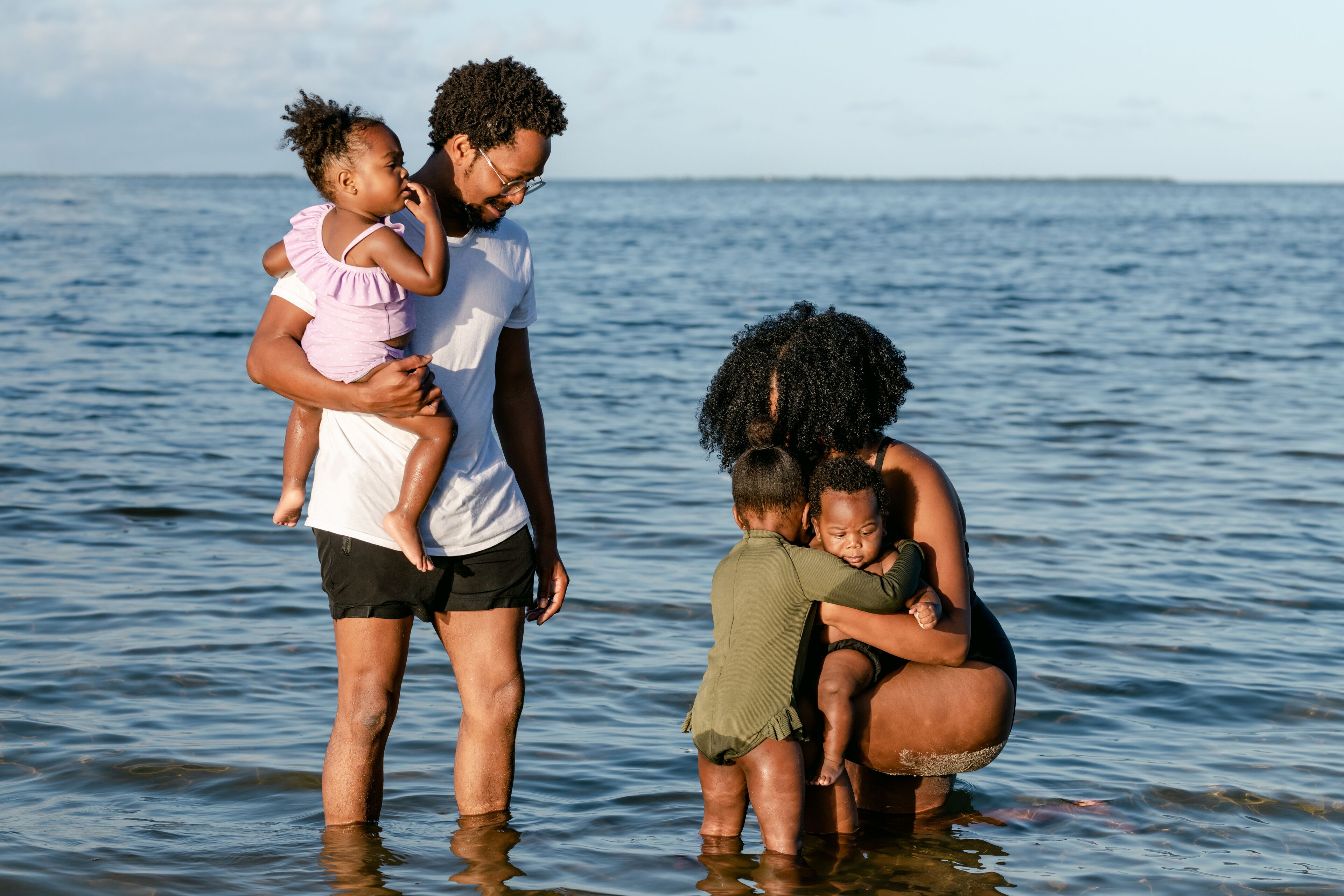 Sister hugging her brother at the beach