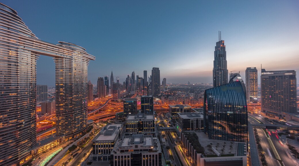 Futuristic Dubai Downtown and finansial district skyline aerial night to day timelapse.