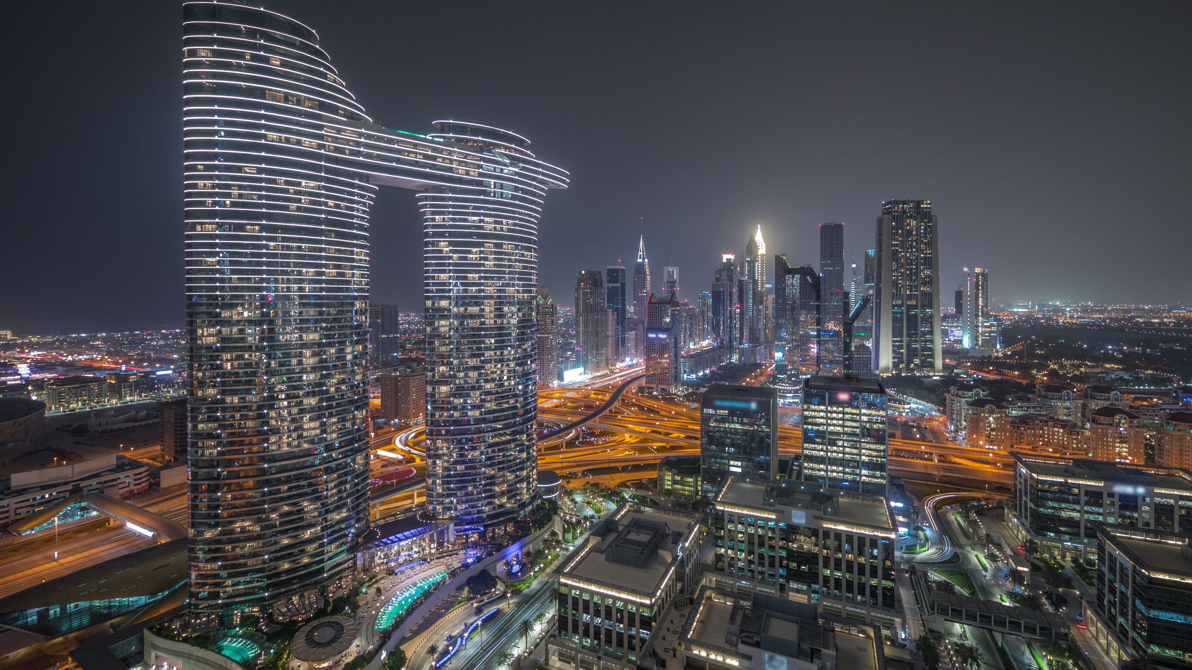 Futuristic Dubai Downtown and finansial district skyline aerial night timelapse.
