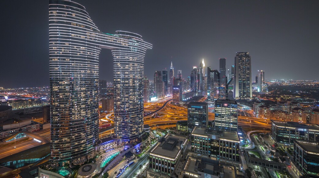 Futuristic Dubai Downtown and finansial district skyline aerial night timelapse.