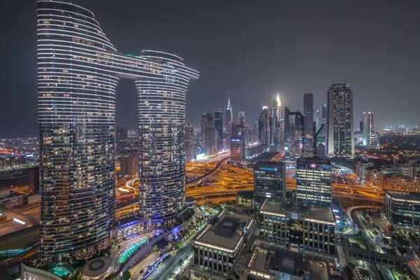 Futuristic Dubai Downtown and finansial district skyline aerial night timelapse.
