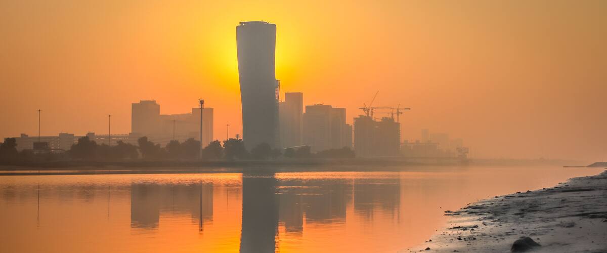 Sunrise Sky view background behind capital gate tower of Abu Dhabi, Skyscrapers in Capital city of United Arab Emirates