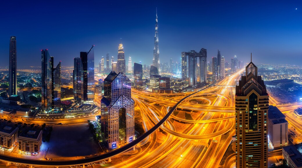 Dubai skyline at night, panoramic aerial top view to downtown city center landmarks. Famous viewpoint, United Arab Emirates