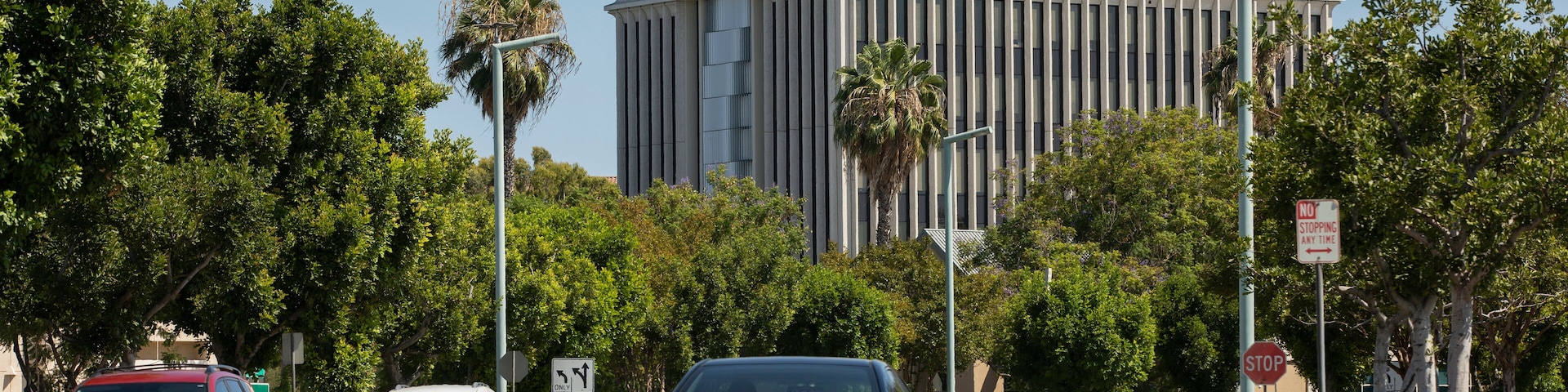 Afternoon palm framed view of the downtown skyline of West Covina, California, USA.