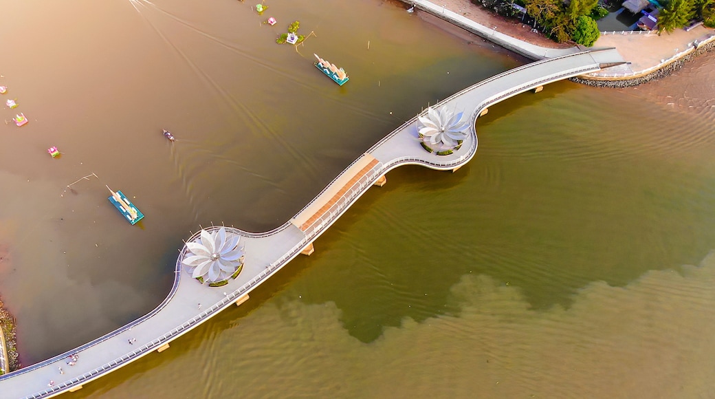 A bridge with a flower-like design over a body of water.