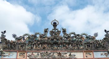A detailed dragon sculpture with intricate carvings and figures.