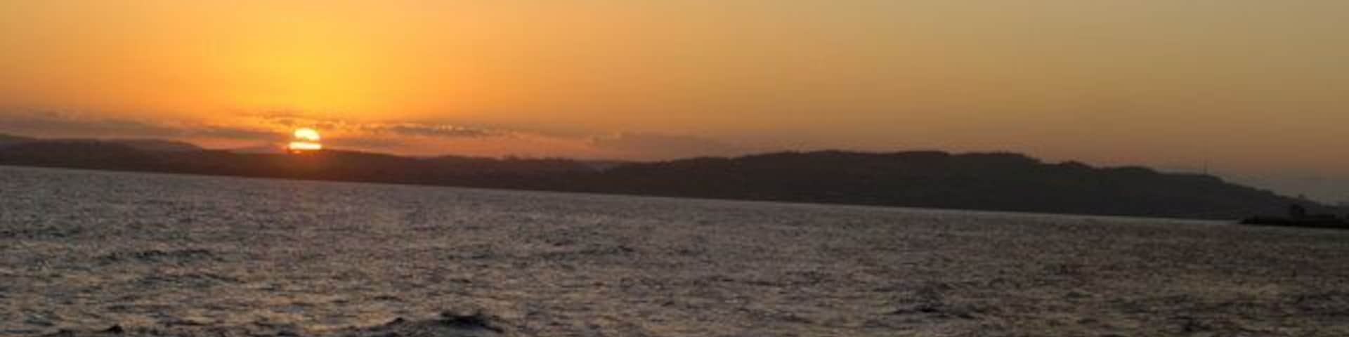Sunset on the River Tay Estuary To the left would be Tentsmuir Forest and to the right would be Tayport. Broughty Castle is on the extreme right.