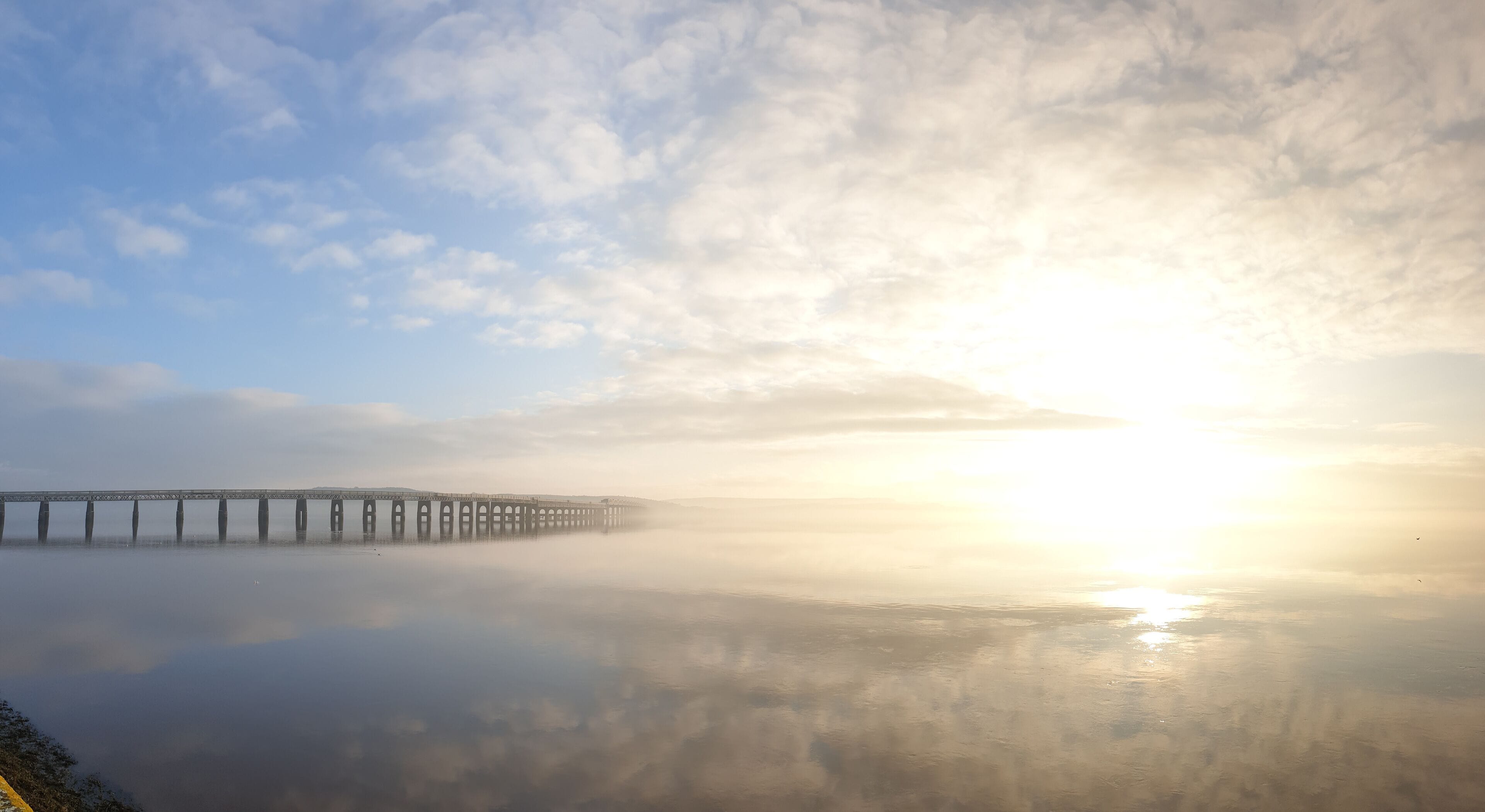 The tay rail bridge looking magnificent in the sun and mist